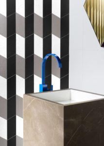 Detail of Marble washbasin with blue tap of Acqua Maximum collection of Graniti Fiandre Photographer Maria Teresa Furnari