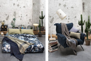A blue armchair with grey blanket of Diesel Home Linen Collection Photographer Maria Teresa Furnari