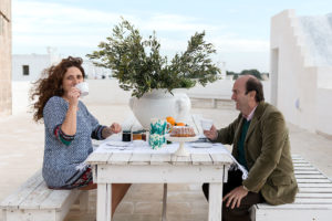 A couple doing breakfast in terrace at Masseria Potenti in Puglia Photographer Maria Teresa Furnari