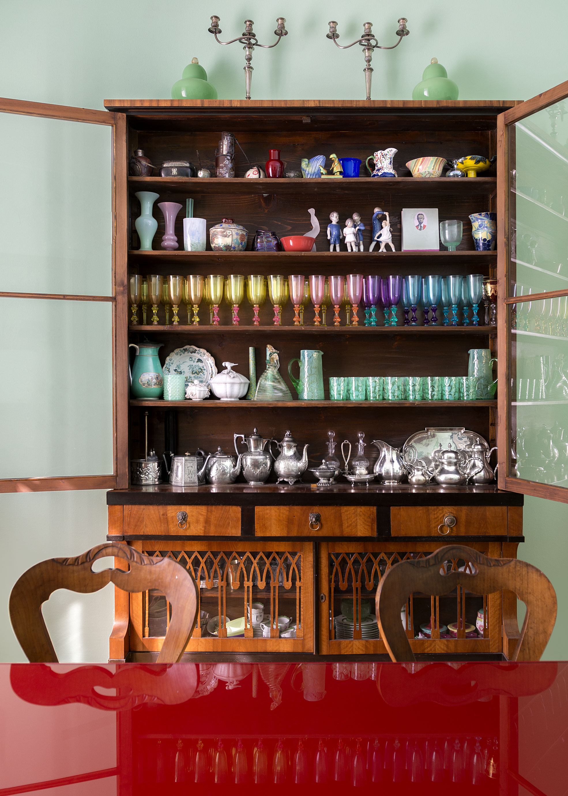 Colored glasses in a book shelf of Elena Corner's house Photographer Maria Teresa Furnari