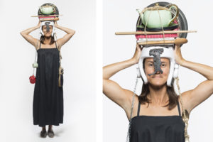 Photo of a woman with objects on her heads the picture is part of Wearable Homes a design project by Denise Bonapace