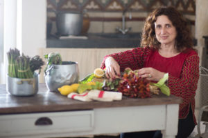 A woman cooking artichockes