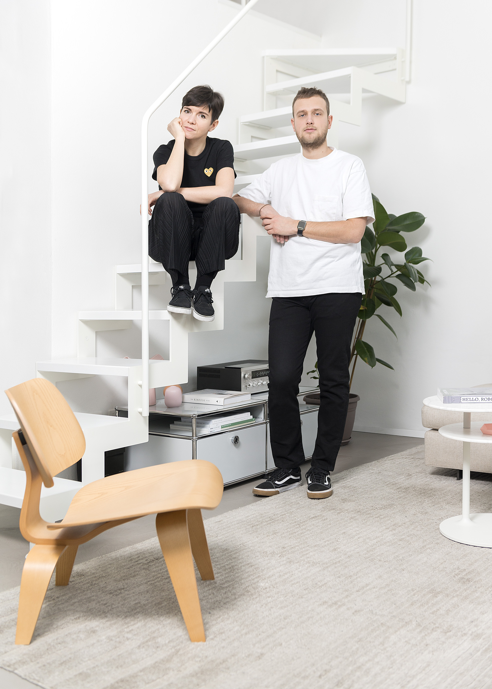 Portrait on stairs of Riccardo Crenna and Simona Flacco, founders of Simple Flair, in their Simple Flair Apartment Photographer Maria Teresa Furnari