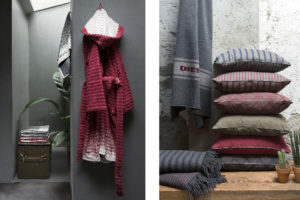 A red bathrobe and some pillows of Diesel Home Linen Collection Photographer Maria Teresa Furnari