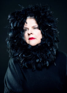 Portrait of an elderly woman with dark plumage Make Up By Daniele Francolino Photographer Maria Teresa Furnari