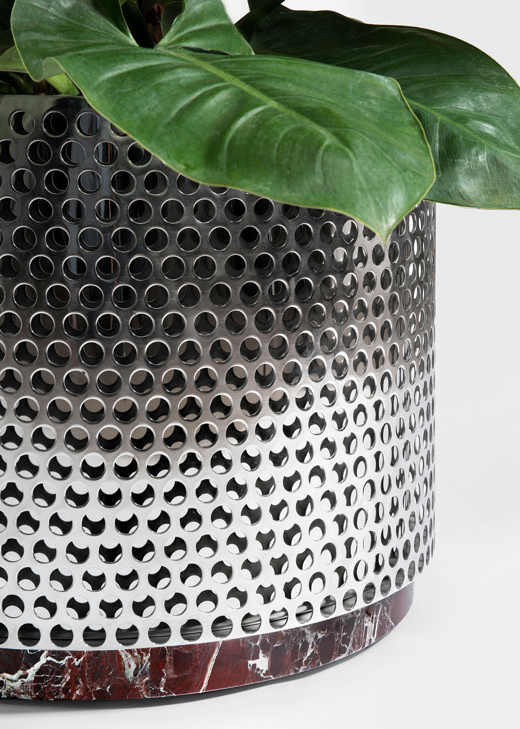 Close Up of Metal Vase medium size with red marble design by Derek Castiglioni Photographer Maria Teresa Furnari